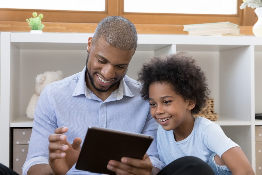 social emotional awareness examples of image with the father and child looking at the tablet