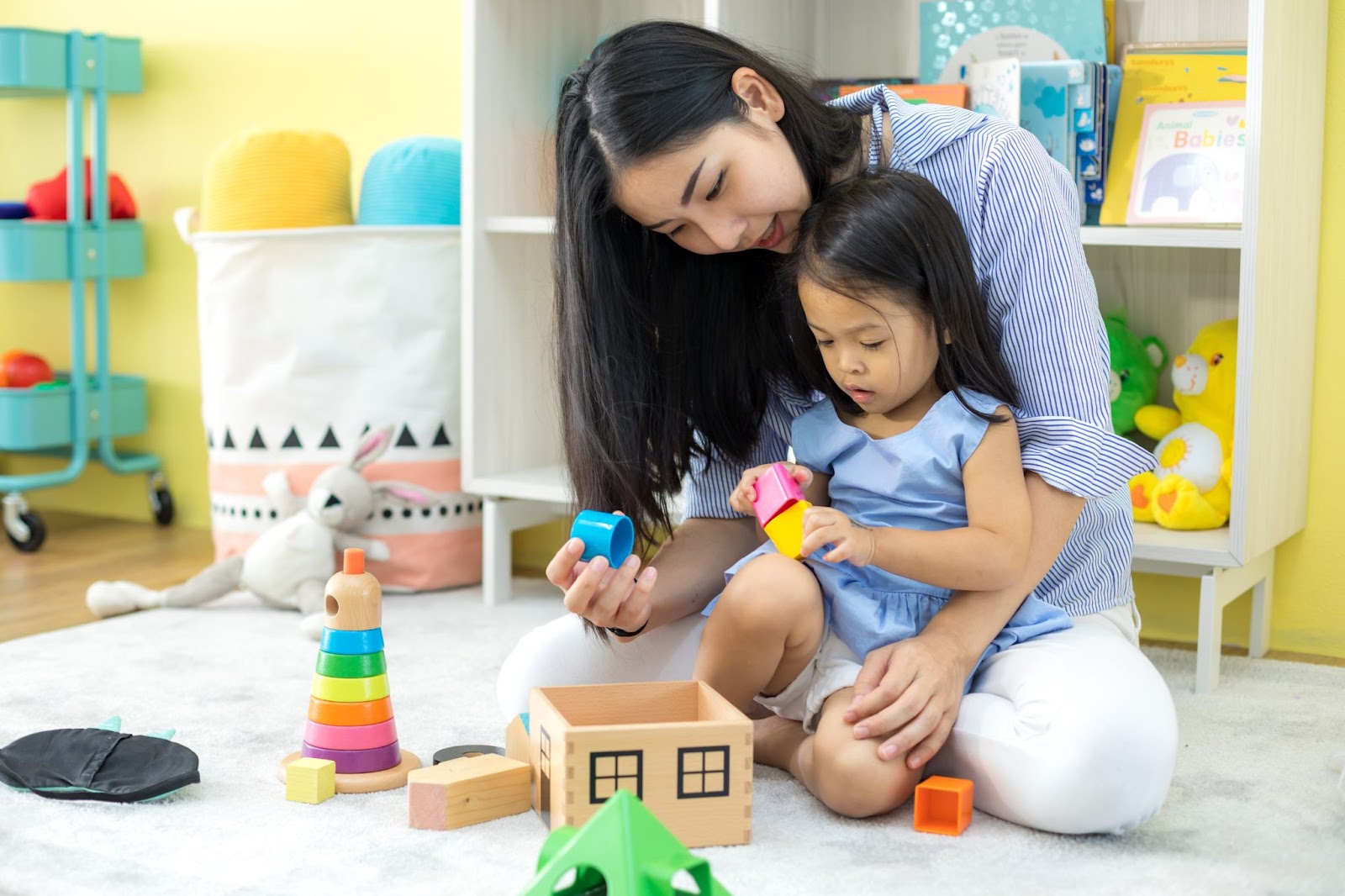 Montessori Parent playing with her daughter. 
