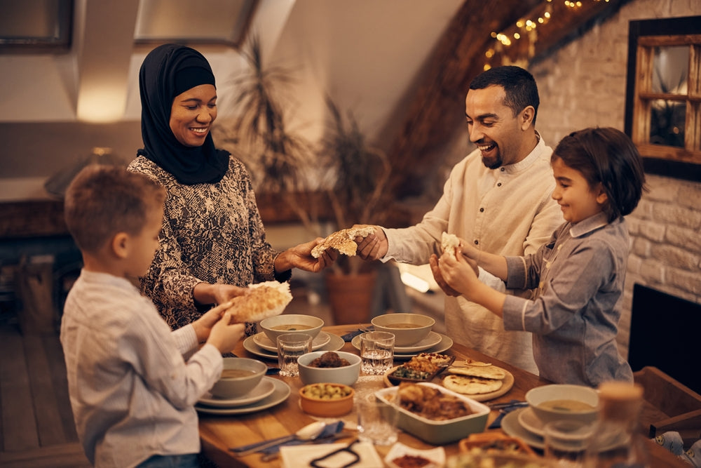 Muslim family enjoying meal together and having dinner