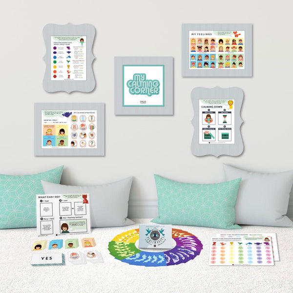 Full Time-In ToolKit display with framed posters on wall, cards, and spinner laid out on a sofa